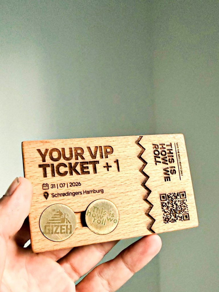 Wooden VIP invitation card engraved for Gizeh's event This Is How We Roll, held in hand