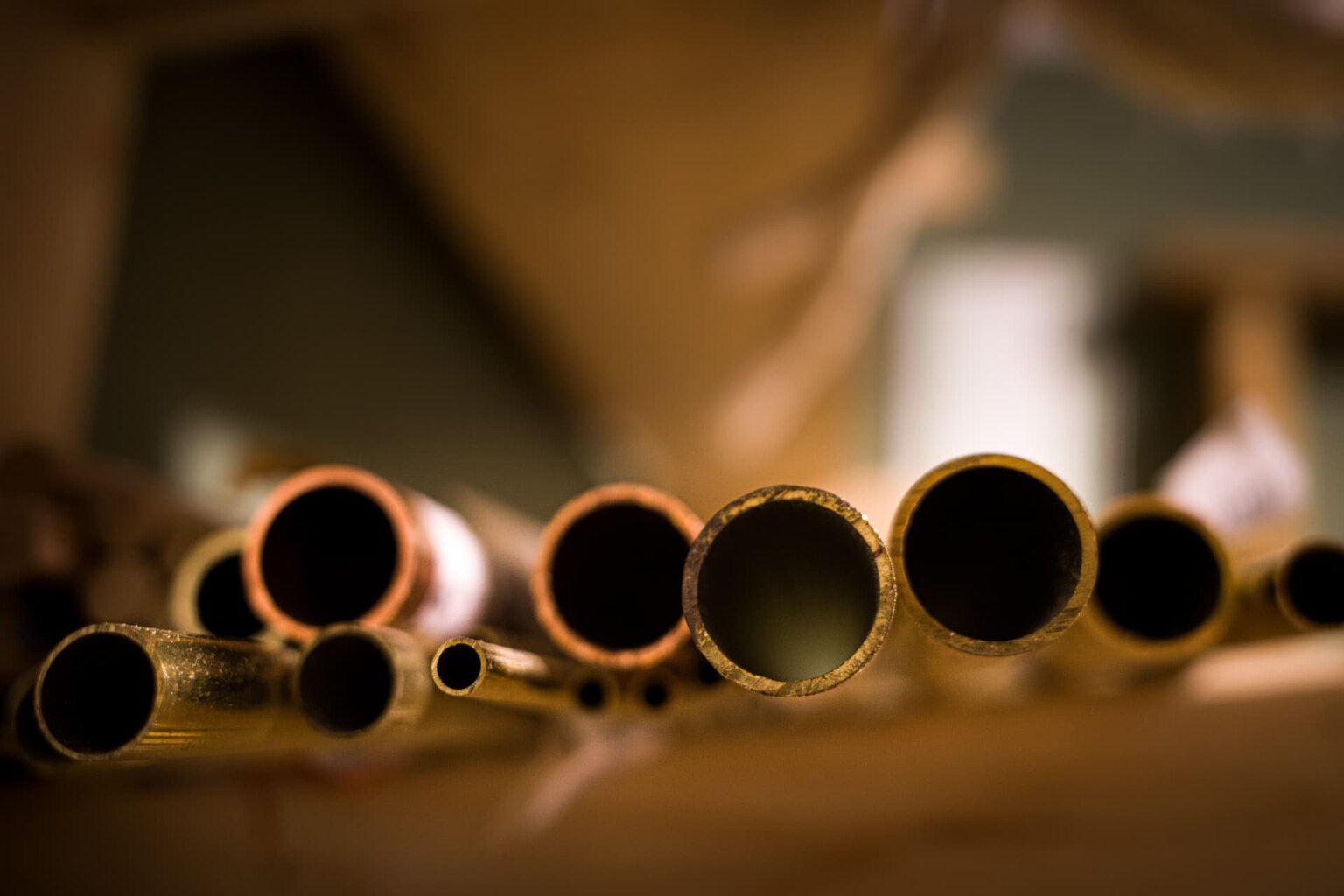 Brass and copper tube stock waiting to be worked in the workshop
