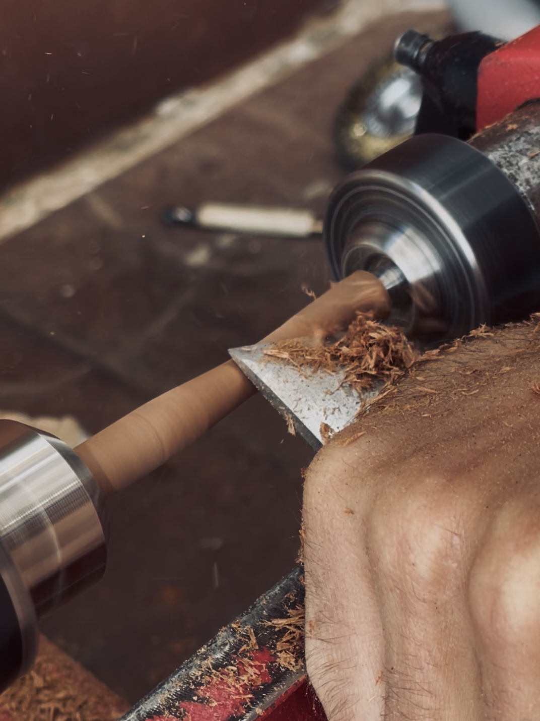 A piece of wood being turned on the lathe in the UMO® Studio workshop