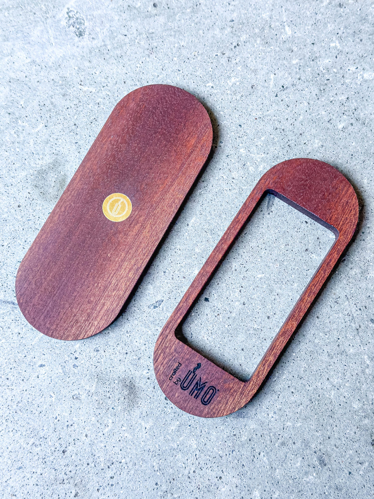 Two-piece Donut Press accessory handcrafted from dark reddish-brown wood with a rectangular cutout and engraved logo.